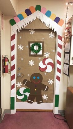 a door decorated with gingerbreads and candy canes