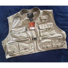 This White River Wrfs Journeyman Vest Is Perfect For Any Man Who Loves Fishing. With Its Solid Khaki Color, Cotton Outer Shell Material, And Cotton Lining Material, This Vest Is Both Stylish And Comfortable. It Features A Zip Closure, Zipped Pockets, And The White River Logo As Accents. This Vest Is Part Of The White River Product Line And Is Designed For Big And Tall Men, With A Size Of 2xl. It Is Suitable For Workwear And Activities Like Fishing, Making It A Versatile Addition To Any Wardrobe. River Logo, Mens Fleece Vest, Hiking Vest, Winter Puffer Vest, Argyle Vest, Fishing Vest, Sweater Vest Mens, Mens Suit Vest, Motorcycle Vest