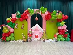 a stage set up with balloons and decorations for a children's birthday or baby shower