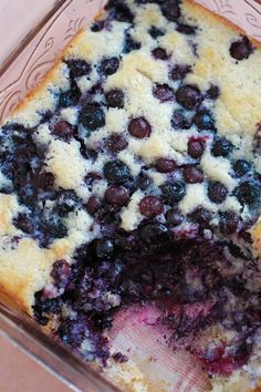 a close up of a blueberry cake in a pan