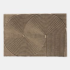 a brown door mat with circles on it