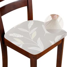 a wooden chair with a fabric covered seat pad