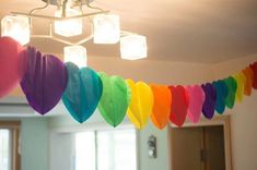 colorful paper hearts hanging from the ceiling