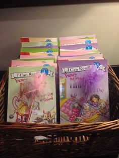 several children's books in a wicker basket