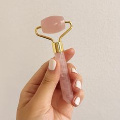 Elevate your skincare routine with the Mei Apothecary Mini Rose Quartz Roller Beauty Tool. Face rolling is an ancient beauty ritual that has been practiced for centuries, starting with Chinese royalty. It is the perfect complement to any serum, oil, moisturizer or mask. The Mini Rose Quartz Roller Beauty Tool is travel-sized and great to keep in your purse, at your desk or even in your gym bag. Our easy-to-hold handle with tarnish-proof metal makes it convenient to use on-the-go. The mini rose q Rose Quartz Roller Benefits, How To Use Rose Quartz Facial Roller, Pink Balls Face Roller, Crystal Face Roller, Facial Puffiness, Rose Quartz Facial Roller, Gua Sha Facial, Face Roller, Facial Roller