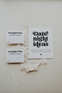 some type of business cards sitting on top of a white surface with the words date night ideas printed on them