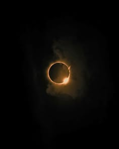 the eclipse is seen through clouds in this photo taken by nasa astronauts on july 22, 2013