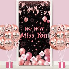 we will miss you balloons and gifts in front of a pink backdrop with stars, confetti and streamers