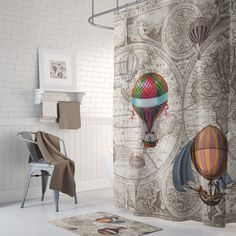 a shower curtain with hot air balloons in the sky on it's side, next to a chair