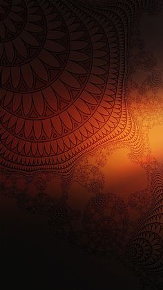 an orange and black background with intricate designs on it's side, as seen from the bottom