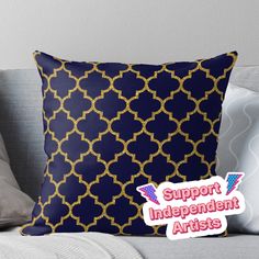 a blue and gold pillow with the words support independent artists on it