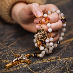 Theotokos CHARTRES rosary is made with stone, glass, metal and wood, just like the stunning cathedral its design was inspired by. Available at theotokosrosaries.com or click the link in our bio ⭐️ #theotokosrosaries #catholicrosary #rosarymaker #beautifulrosary #catholicmoms #catholicwife #catholicman #catholicfaith #catholicfamilylife #bridalgifts #catholicgifts #traditionalbeauty #tradcat #giftshop #luxurygifts Spiritual Crucifix Rosary As Gift, Spiritual Wedding Rosary With Crucifix, Bronze Rosary As Gift, Hand-strung Rosary As A Gift, Spiritual Hallmarked Crucifix Jewelry, Holy Rosary, Catholic Gifts