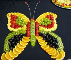 a butterfly made out of fruits and vegetables