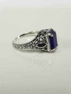 "Thanks for shopping our vintage estate store. We tend to sell well below wholesale and truly hope you enjoy all of our items. Many of the items are one of a kind, so please enjoy scrolling through the pictures and hopefully something will catch your eye. Brown spots are from the camera or reflections Estate sterling silver 925 natural 2ct lapis lazuli sapphire filigree vintage style ring. Last 3 pictures are natural light. Retails $249 on sale $99 Ring size: please select a size Setting: 3/8\" Elegant Nickel-free Engraved Ring For Anniversary, Vintage Sterling Silver Filigree Ring, Vintage Sapphire Jewelry For Formal Occasions, Vintage Sapphire Jewelry With Emerald Cut, Vintage Sapphire Emerald-cut Jewelry, Vintage Emerald-cut Sapphire Jewelry, Vintage Emerald Cut Sapphire Jewelry, Vintage Sterling Silver Filigree Ring Collectible, Vintage Sterling Silver Filigree Ring As Gift