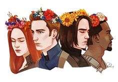 three people with flowers in their hair