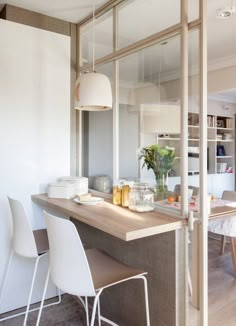 the kitchen is clean and ready to be used as a dining room or office space