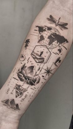 a person with a tattoo on their arm that has pictures and symbols all over it