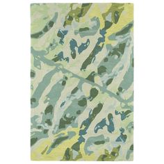 a green and yellow area rug with an abstract design on the bottom, in front of a white background