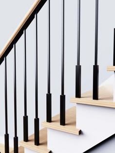 an image of a stair case with black and white railings on the bottom handrail