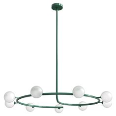 a green chandelier with five white balls hanging from the center and four lights on each end