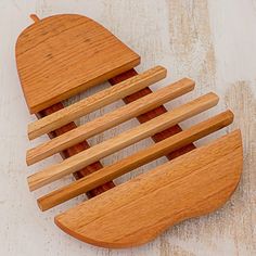 a wooden comb with four sections on it