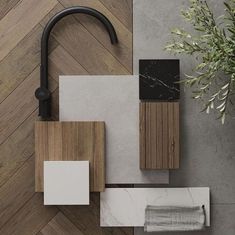 an overhead view of a bathroom with wood accents and tile on the floor, along with a potted plant