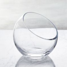 a clear glass bowl sitting on top of a white counter