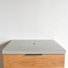 an apple computer sitting on top of a wooden box