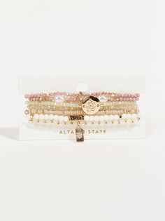 Elevate your accessory game with this set that effortlessly combines charm and adaptability. This pack of layered beaded stretch charm bracelets, offer versatile and stylish wrist accessories for any occasion Altard State Bracelets, Taylor Swift Christmas, Wrist Accessories, Bracelet Pack, Wedding Branding, Bow Bracelet, Floral Shop, Layered Bracelets, Mini Dress Shop