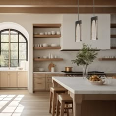 a large kitchen with lots of counter space and wooden cabinets, along with an arched window