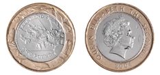 two pound coins with the image of queen elizabeth and prince george on them, side by side