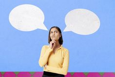 a woman standing in front of a wall with two speech bubbles above her head