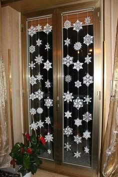 a pair of glass doors with snowflakes on them