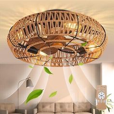 a living room filled with furniture and a wooden chandelier hanging from the ceiling