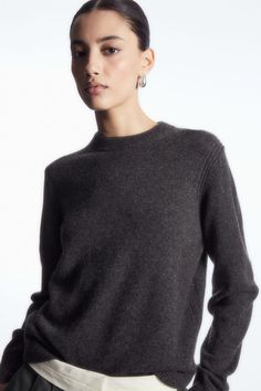 This timeless jumper is a cornerstone of the COS Autumn Winter collections. Offered in a rich dark-brown hue, it's expertly knitted from luxuriously soft 100% cashmere that has been certified by the Good Cashmere Standard, ensuring that it's fully traceable. It's designed with a classic crew neck and neat ribbed trims. Regular fitThe Good Cashmere Standard® is owned by Aid by Trade Foundation(AbTF) and sets out requirements on welfare of cashmere goats, use of natural resources and support of fa Dark Grey Jumper Outfit, Grey And Brown Outfit, Cos Sweater, Grey Knitwear, Timeless Sweater, Gray Cashmere Sweater, Jumper Outfit, Cashmere Hoodie, Grey Jumper