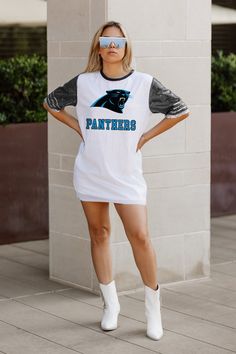 Elevate your game day look with our Carolina Panthers full sequin jersey tunic dress. Designed with sports striping details on the sleeves and a lightweight garment lining, it ensures both style and comfort. Whether you're cheering from the stands or watching from home, rock your favorite school or team in standout fashion. Fitted T-shirt For Game Day, Sequin Jersey Dress, Sequin Jersey, Carolina Panthers, Jersey Dress, Tunic Dress, Game Day, From Home, Sequin