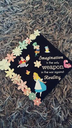 there is a graduation cap that has been decorated with images of children and words on it