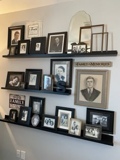 a wall filled with pictures and framed photos