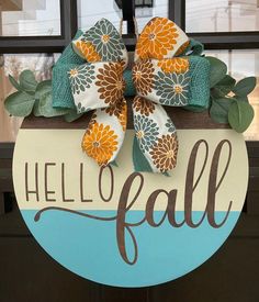 a door hanger that says hello fall with flowers and leaves on the front of it