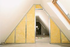 an attic with insulation installed in it