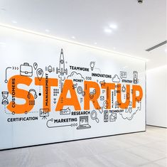 a wall with words written on it that say start up