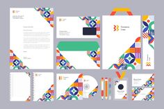 the stationery is designed with colorful geometric shapes and lines, including an envelope, business card