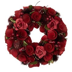 a christmas wreath with red flowers and berries