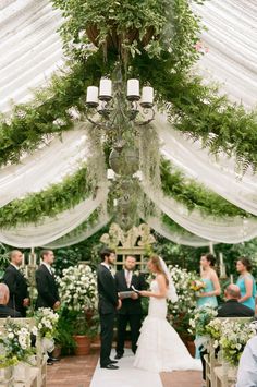 the bride and groom are getting married at their wedding ceremony