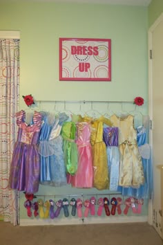 there are many dresses hanging on the rack