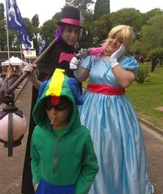 three people dressed up in costumes standing next to each other