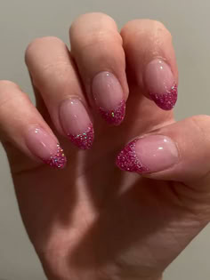 pink French tip nails: hot pink glitter Glittery Nails French Tip, Pink Tip Nails Glitter, Nail Ideas Glitter French Tip, Hot Pink French Tip With Glitter, Sparkle Pink French Tip Nails, Light Pink Glitter French Tip Nails, Pink Tip Nails With Glitter, Pink French Tips Glitter, Glittery Pink Nails French Tip