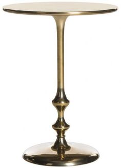 a gold pedestal table with a glass top and metal base on an isolated white background