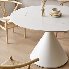 a white table and chairs in a room