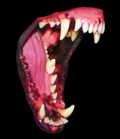 an animal's mouth is shown with teeth and fangs on the outside of it